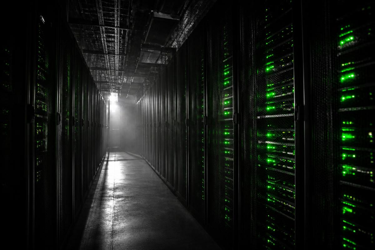 Data centre corridor with green rack indicator lights